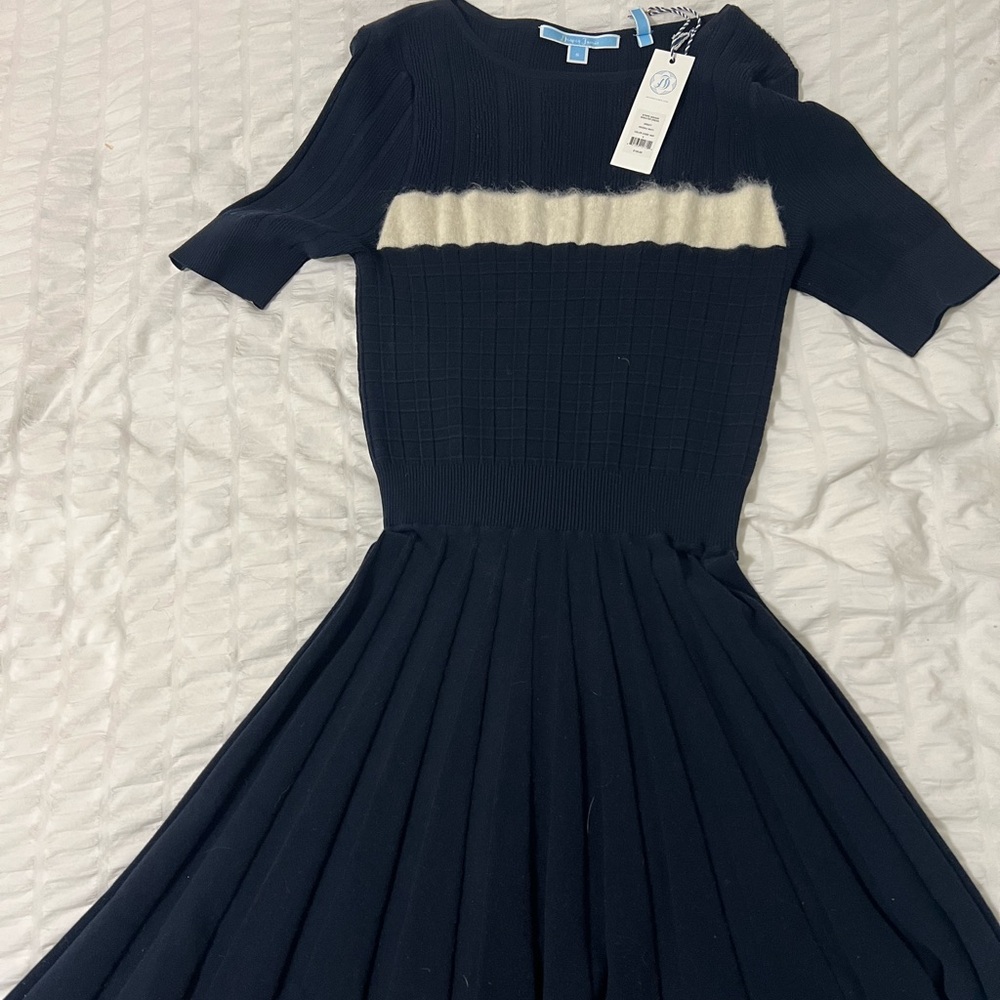 Navy dress with cream detail. Brand new never worn.